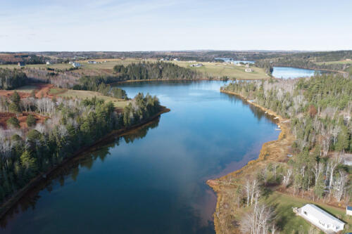 Trout River winding by the community