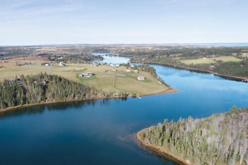 Trout River winding by the community